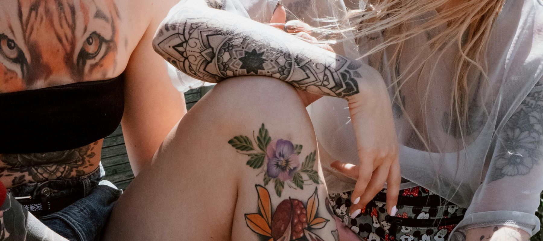 Two women with tattoos